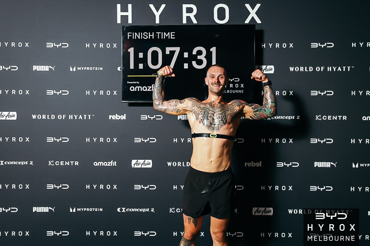 Jordon Mudge at the HYROX Melbourne finish line with 1:07:31 on the clock